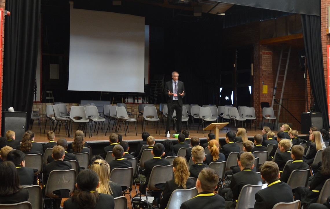 First Year pupils listen to a talk from the Headmaster during their first day at the Senior School