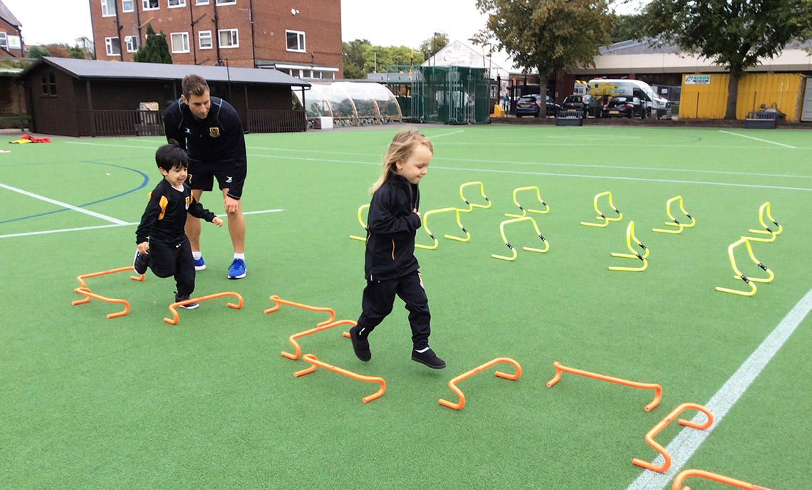 Pupils enjoy a PE lesson during their first day in Pre-Reception