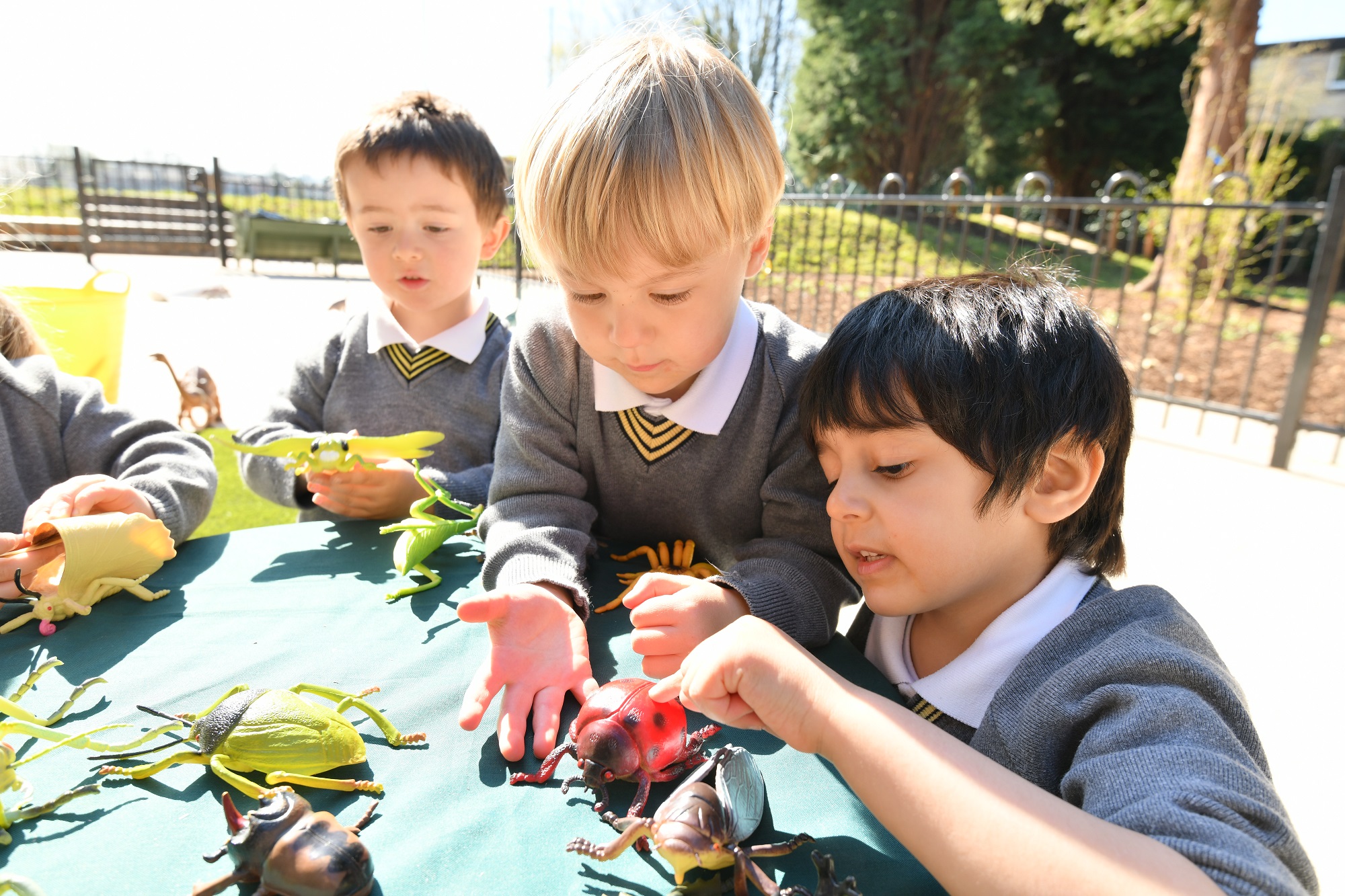 Nursery pupils enjoy an outdoor lesson