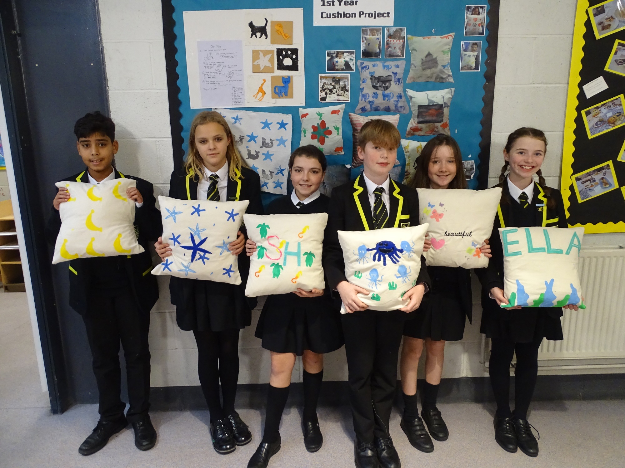 First Year pupils with their finished pillows from the Textiles Technology project