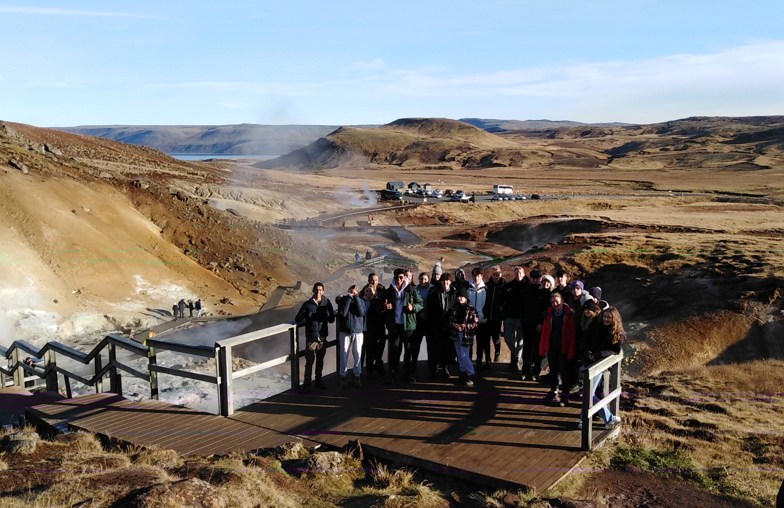 Students pose for a picture in front of stunning scenery during their Geography trip to Iceland