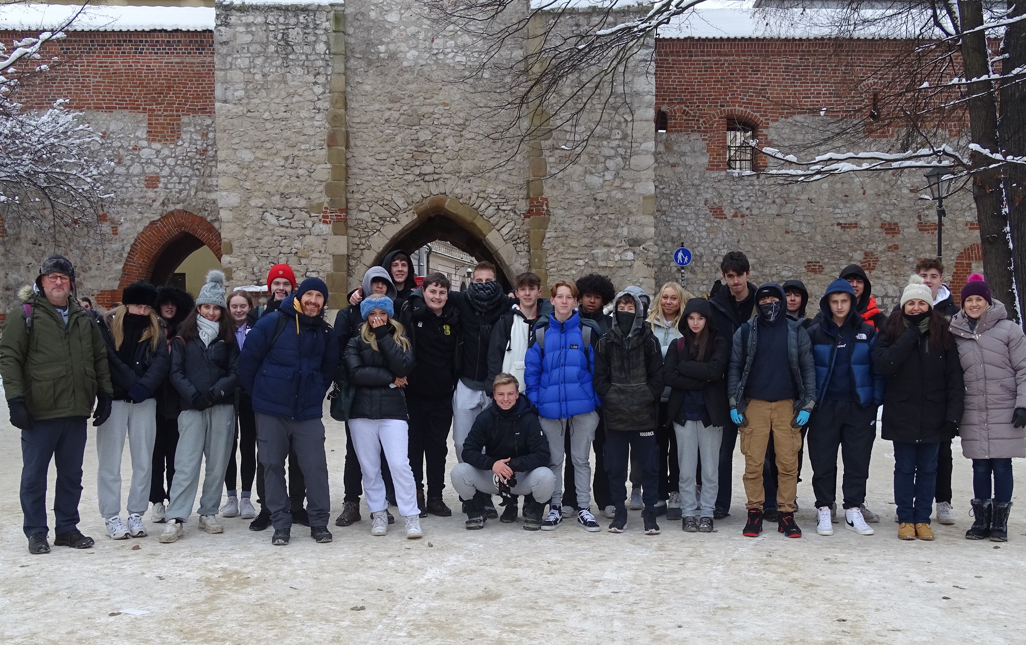 Students pose outside a castle during their Religion, Philosophy and Ethics and History trip to Poland