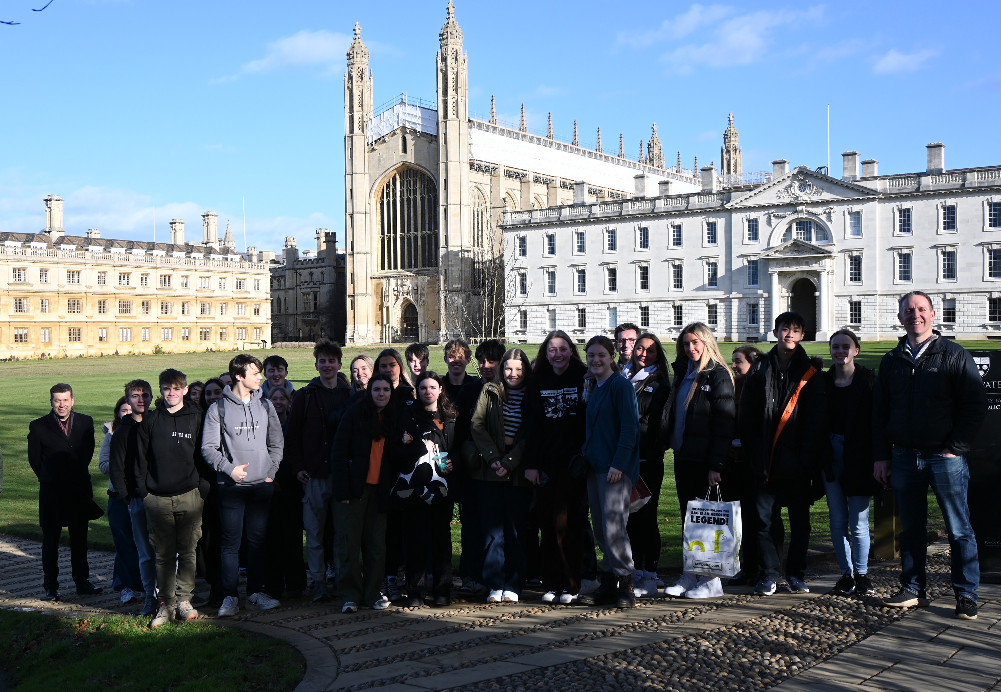 Chamber Choir students and Music department staff pose for a photo during their trip to Cambridge