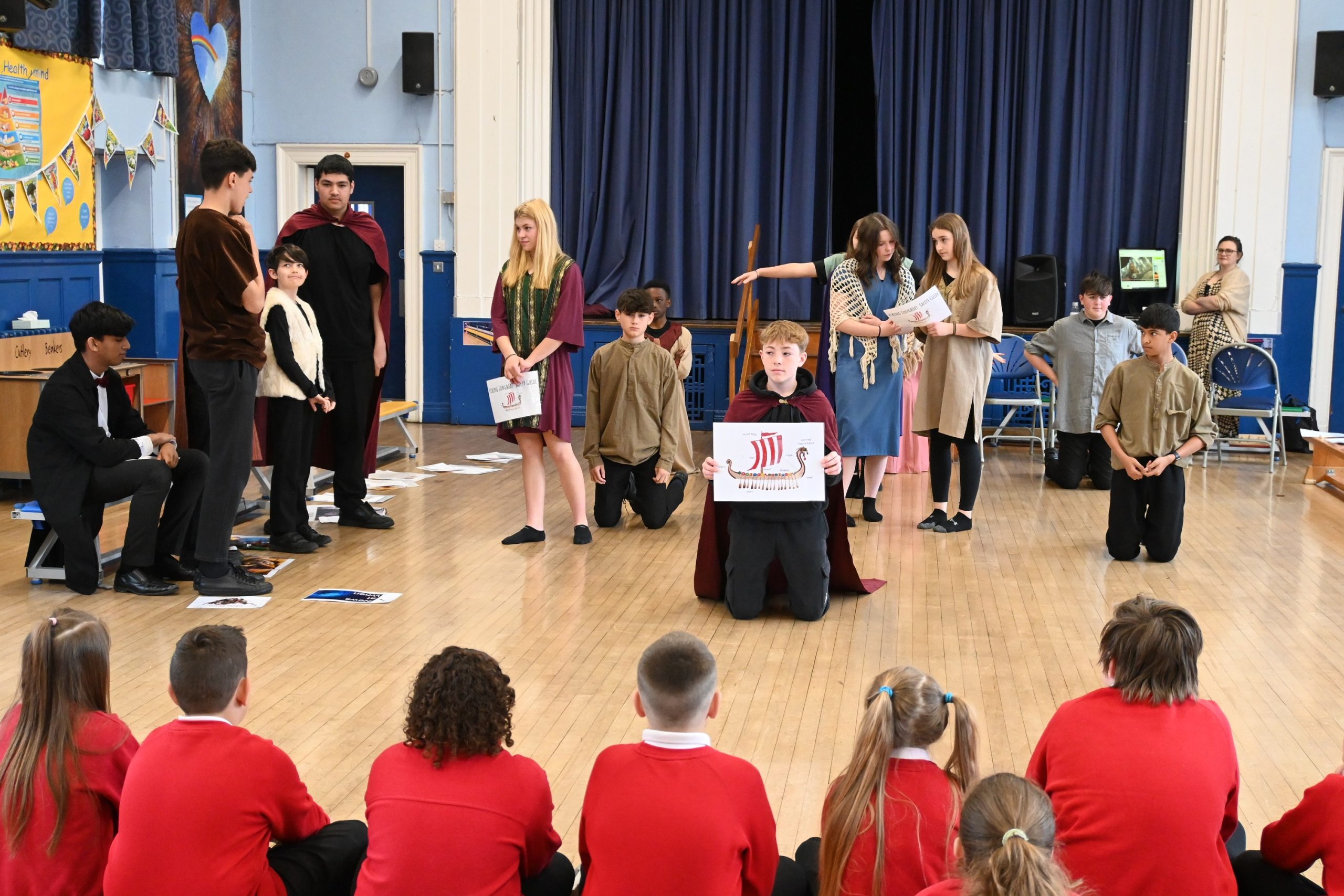 Pupils watch a scene being delivered during a Theatre in Education visit