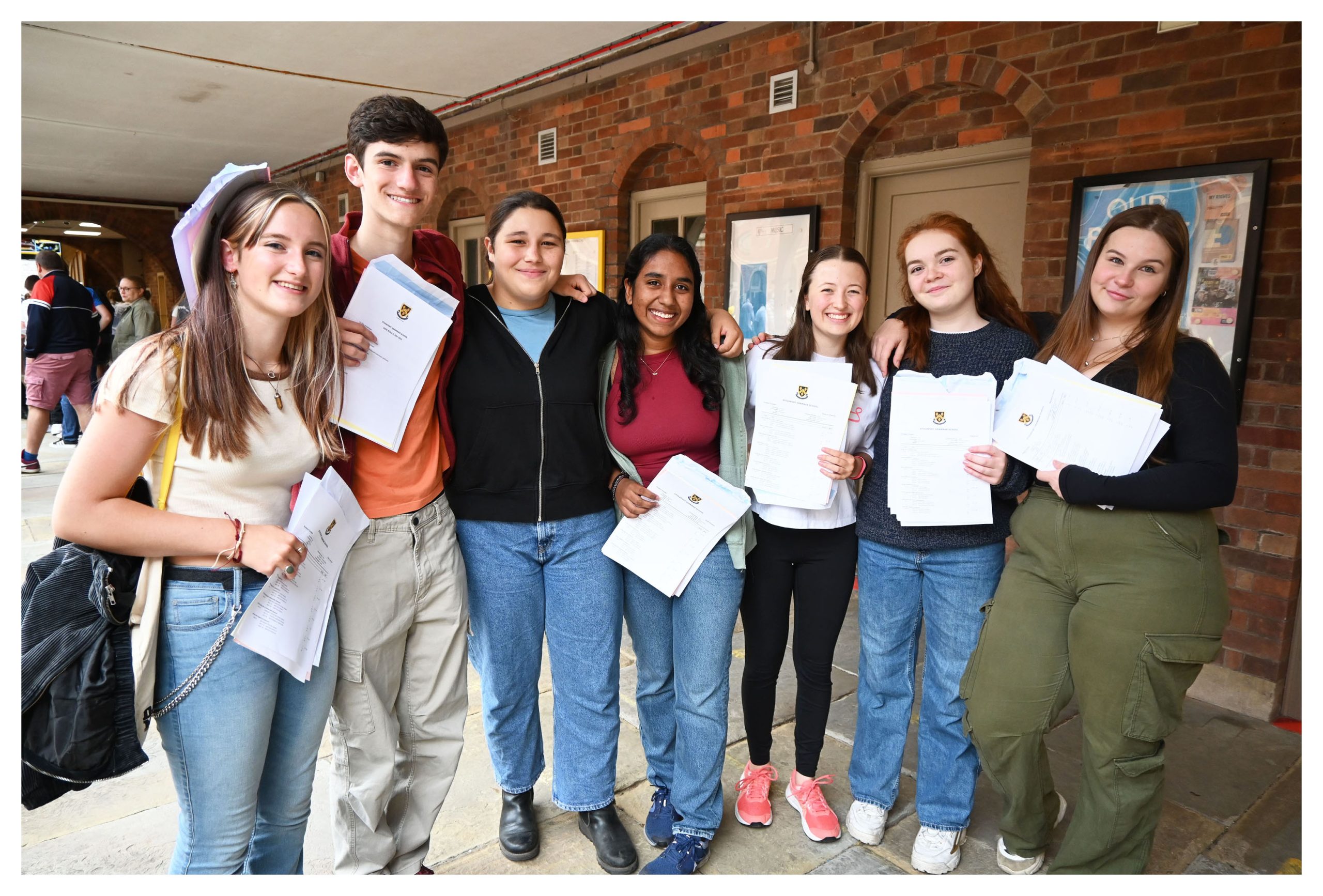 GCSE students with their results