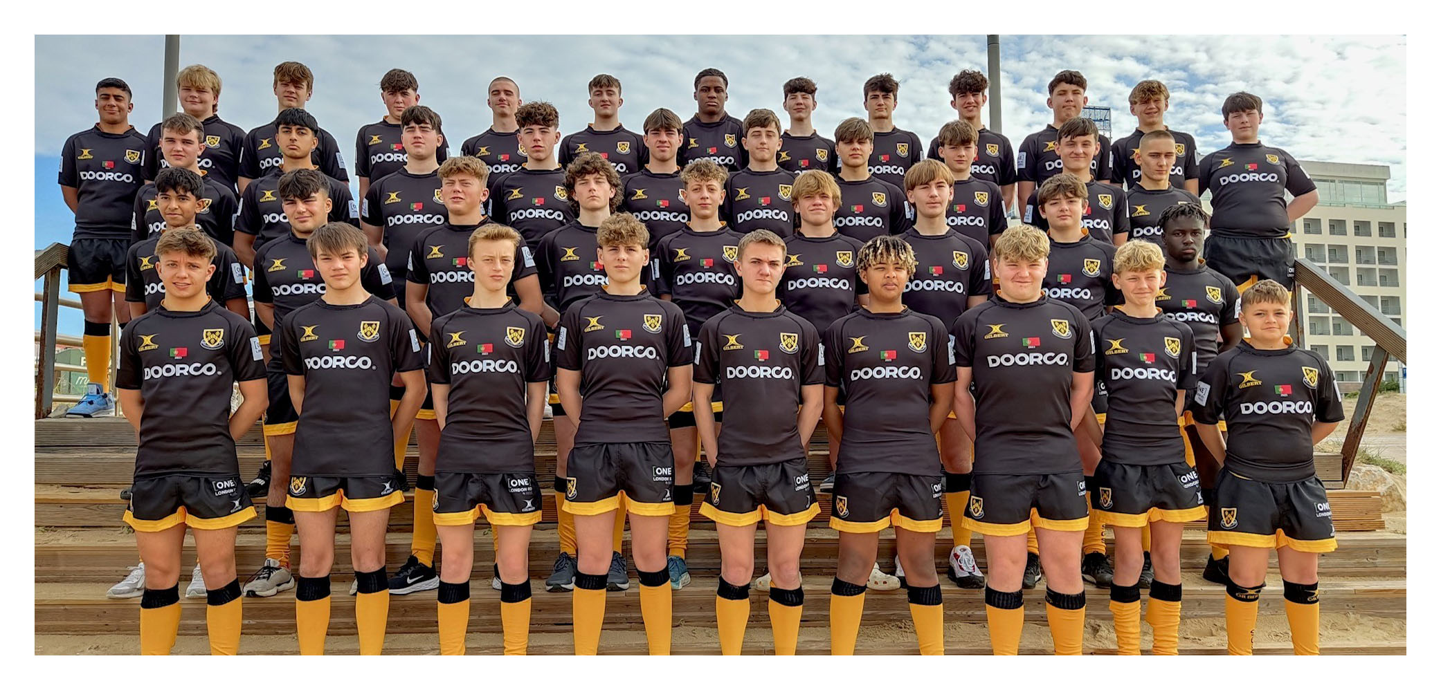 Fourth and Fifth Year rugby players in their black kit during their trip to Portugal