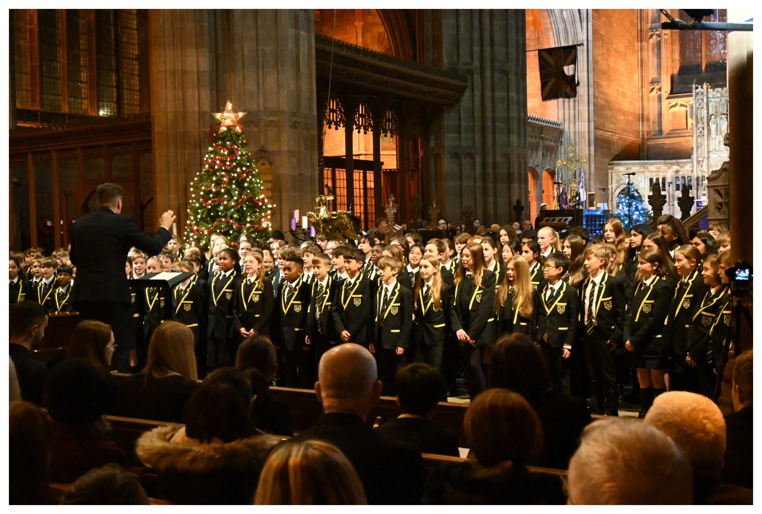 Junior School pupils sing at the front of the church at the 2023 Carol Service