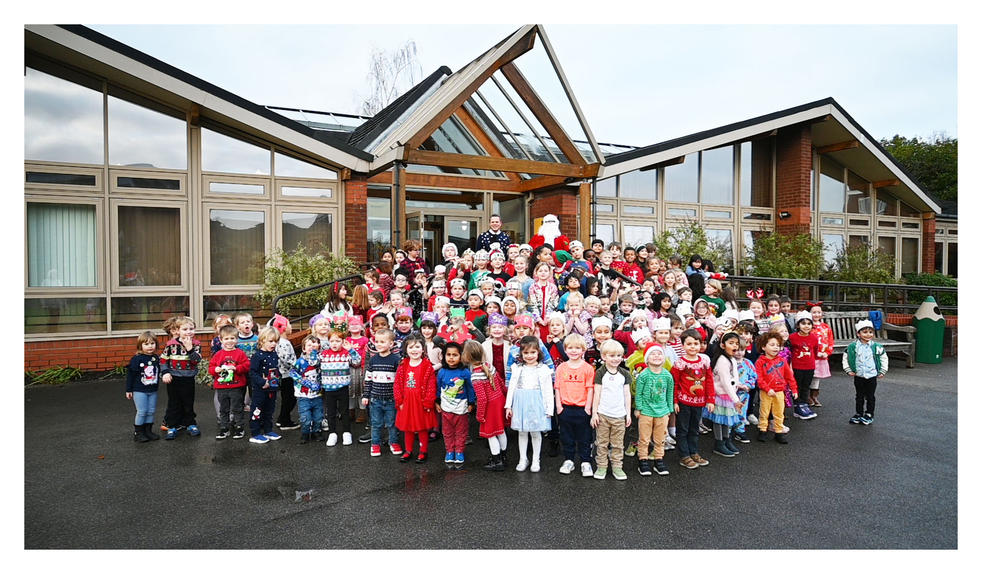 Junior School pupils pose for a picture with Father Christmas